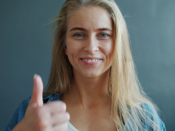 Woman giving a thumbs-up gesture